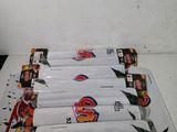 five skateboards sitting on top of each other on a table
