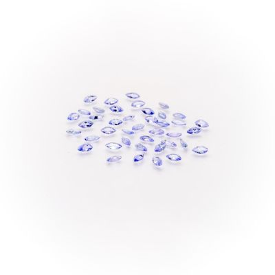 a pile of blue sapphires on a white background