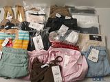 many different types of clothing on display in a box