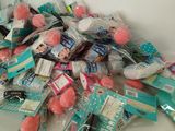 a pile of toothbrushes and toothpaste on a counter