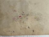 a piece of paper that has been left on the floor