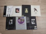 a lot of books on the floor with pictures on them