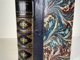 a close up of a book on a table with a white background