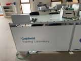 a desk with a sign that says gephaid training laboratory