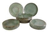 four pieces of green pottery sitting on top of each other