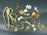 a lot of gold and silver jewelry on a table