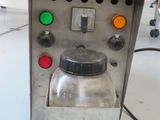 a machine that is sitting on a white table