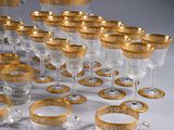 a lot of glasses that are sitting on a table