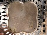 a close up of a metal object with a metal frame