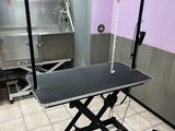 an image of a room with a table and a chair in it