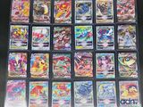 a close up of a collection of pokemon cards on a table