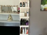 a bathroom with a sink and a mirror in it