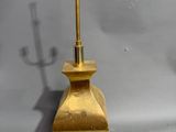 pair of brass table lamps with shades on each of them