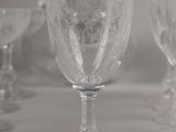 a lot of wine glasses sitting on a table