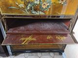 a cabinet that has been painted with flowers on it