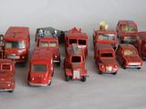 a lot of toy fire trucks that are lined up together