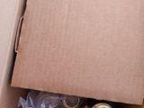 a cardboard box that has a couple of items inside of it