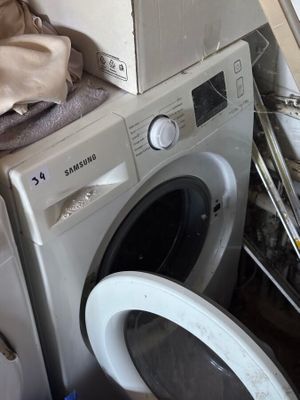 a washing machine and a dryer sitting next to each other