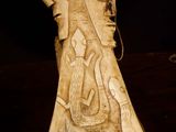 carvings of a man and a woman on a piece of stone