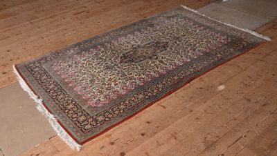 a rug on the floor in the middle of a room