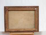 an old wooden easel with a painting on top of it