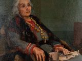 an old painting of a woman sitting in a chair with a book