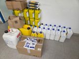 a lot of containers and containers of milk and other items on the floor