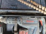 an image of a corded drill and a hammer