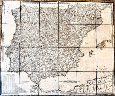une vieille carte de l'Espagne et du Portugal posée sur une table en bois