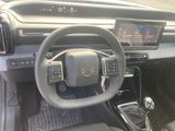 a picture of a car dashboard with a steering wheel and dashboard controls