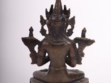 bronze statue of the hindu god ganesha on a white background