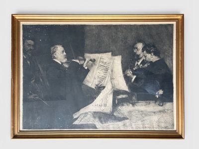 an old picture of two men sitting at a table with a sheet of paper in front of them