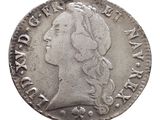 a close up of a coin with a woman ' s face on it