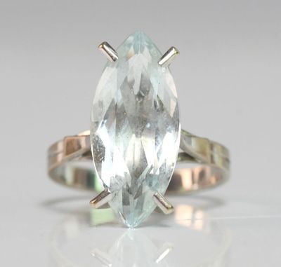 an image of a ring with an aquamarinee stone in it