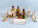 many bottles and a box of medicine on a table