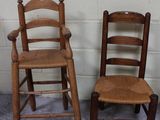 two wooden chairs sitting next to each other in a room
