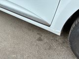a close up of a car ' s tire with a hole in it