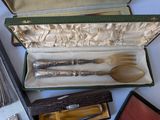a silverware set in a case on a table