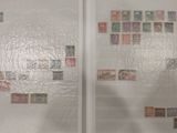 a picture of a glass door with stamps on it