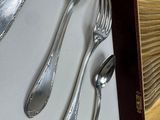 silver spoons, forks and spoons on a table