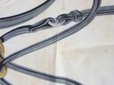 an image of a close up of a table cloth with a clock on it