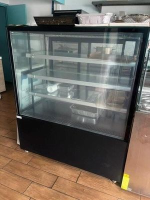 a glass display case in the middle of the floor