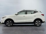 a white nissan qx suv parked in a parking lot