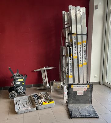 a room that has a lot of boxes and tools on the floor