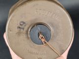 a person holding a metal object in their hand