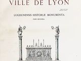 an old book with a drawing of a city on it