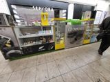 a man walking past a vending machine in a store