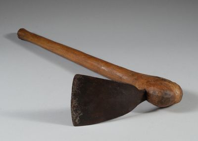 an old axe and an old axe on a white surface