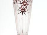 a glass vase that has a star design on it