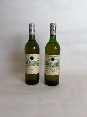 two bottles of wine sitting next to each other on a table